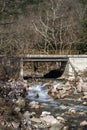 View of a small mountain river and bridge Royalty Free Stock Photo