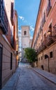 View of Small Narrow Streets of Toledo Spain With Clear Skies Leading to a Church Royalty Free Stock Photo