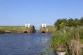 View of a small and old lock on a river flowing into the North Sea Royalty Free Stock Photo