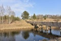 View of a small river with a bridge in spring. Channel of the Vileyka-Minsk water system for the transfer of water flow