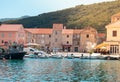 View of a small town center of the town Starigrad at Hvar island. Old small boats in the water as life goes on in a small village Royalty Free Stock Photo