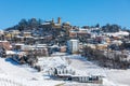 View of small town on the hill covered in snow in Italy. Royalty Free Stock Photo