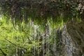 Cascade of water under the rock Royalty Free Stock Photo