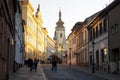 Smetanova Street with the tower of the Church of the Nativity of the Blessed Virgin Mary in the background, Pisek, Czechia