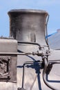 View of the smokestack of an old steam locomotive close-up