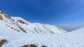 View of the snow-capped mountains. Mountain landscape. The amazing nature of Kyrgyzstan. Blue sky Royalty Free Stock Photo