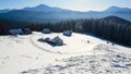 View of the snow capped mountains to the small mountain village Royalty Free Stock Photo