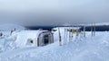 View of the snow-covered module of the Vologda Gran mountain camp in the Ural mountains. Beautiful winter landscape. Tourist skis