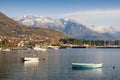View of the snow-covered mountain Lovcen from the Bay of Kotor.Tivat town, Montenegro Royalty Free Stock Photo