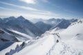 a view of the snow-covered mountain range, with skiers, snowboarders and snowshoe trekkers in action