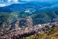 View of snow covered mountains behind the village of Pedoulas. N