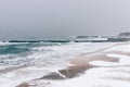 View of snow-covered pier and the sea during a snowfall in winter Royalty Free Stock Photo