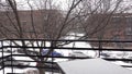 View of snow falling on a balcony