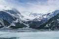 A view of snow filled valleys and moraine on the sides of Glacier Bay, Alaska Royalty Free Stock Photo