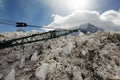 A view of a snow machine with a crane in the snow covered landscape in the alps switzerland