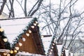 view of snowed roofs of christmas village at city square