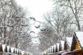 view of snowed roofs of christmas village at city square