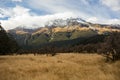 View on a snowy mountain range in clouds over place where Isengard was filmed in LOTR trilogy, Fangorn on the left, Rees Dart