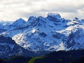 View of the snowy peaks and glaciers of the Swiss Alps from the Pilatus mountain range in the Emmental Alps, Alpnach - Switzerland Royalty Free Stock Photo