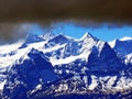 View of the snowy peaks and glaciers of the Swiss Alps from the Pilatus mountain range in the Emmental Alps, Alpnach - Switzerland Royalty Free Stock Photo