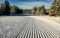 View of a snowy ski resort piste in the early morning Royalty Free Stock Photo