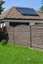 View of solar water-heating vacuum installation on a garage roof Royalty Free Stock Photo