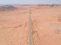 View of a solitary road in Arizona, USA, winding through the desert landscape Royalty Free Stock Photo