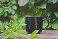 A solo blank white coffee mug on the bamboo table edge Royalty Free Stock Photo