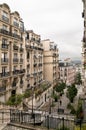 A view of some historical buildings and a little view of Paris, through the buildings in Monmarte Royalty Free Stock Photo