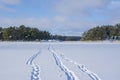 View of The Sommarostrand in winter, frozen sea, foot prints in the snow and islands, Tammisaari archipelago, Raseborg, Finland