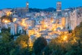 View of Sorano town in the evening night with old tradition buildings and illumination. Tuscany, Italy