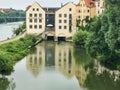 View of the Sorat Insel Hotel in Regensberg, Germany with reflection.  It is located on an island in the Danube River.  . Royalty Free Stock Photo