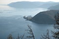 View of source of Angara River and Cape Harbor-Baykal in spring evening