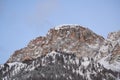 View from the south on the steep Sass da Ciampac Alta Badia, Dolomites, Alps with mountain forest, fresh snow and blue sky. Royalty Free Stock Photo