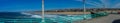 View of Southern California beach from pier on sunny day panorama