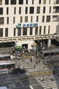 View of the southern exit of Shibuya Station, famous for its moai statue, with buses and taxis stopped at the bus terminal