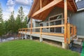 View of a spacious walkout deck with wooden railing Royalty Free Stock Photo