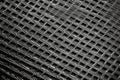 view of sparse gaps in carbon fiber weave Royalty Free Stock Photo