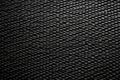 view of sparse gaps in carbon fiber weave Royalty Free Stock Photo