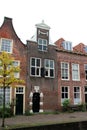 View at a special old house facade and entrance and rooftop in leiden south holland netherlands Royalty Free Stock Photo