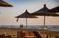 couple walking in Spille beach during sunset in Albania