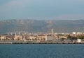 View of Split, Croatia town from a car ferry approaching for very far. Church belltower seen rising above the old buildings, Royalty Free Stock Photo