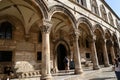 View of Sponza Palace in Dubrovnik with tourists