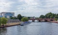 View of the Spree River and the touristic boat close to the Federal Chancellery of Germany in Berlin.