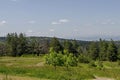 View of springtime glade, forest and residential district of bulgarian village, Vitosha mountain Royalty Free Stock Photo