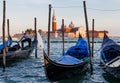 Panoramic view of gondolas at sunset, traditional on Grand Canal with San Giorgio Maggiore church. San Marco, Venice - Italy