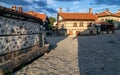 On the street of Bansko town with it`s authentic stone houses in Bulgarian ski resort in summer, Bulgaria.