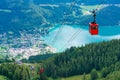 View of St.Gilgen and red Seilbahn cable car gondolas from Zwolferhorn mountain