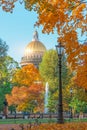 View of St. Isaac`s Cathedral with a fountain through the autumn trees of the Alexander Park St. Petersburg Royalty Free Stock Photo