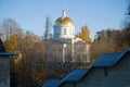 View of St. Michael Cathedral behind the walls of the Holy Dormition Pskovo-Pechersky Monastery on October Day. Pechory, Russia